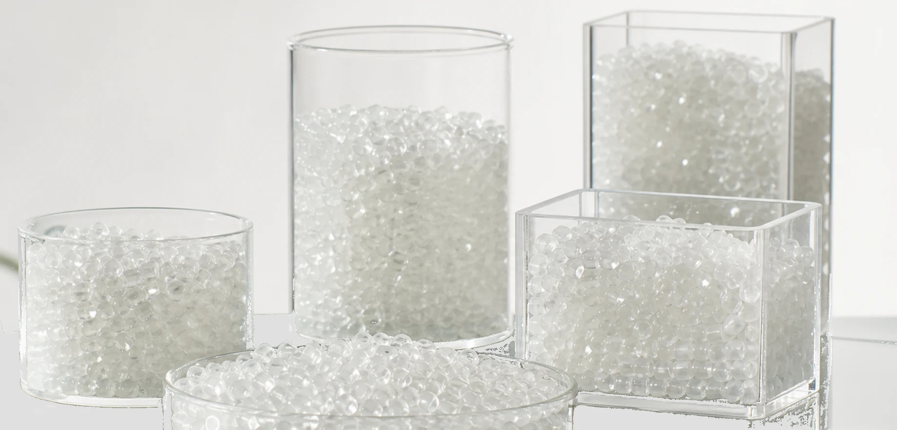 Transparent impact modifier masterbatch granules in clear staggered containers